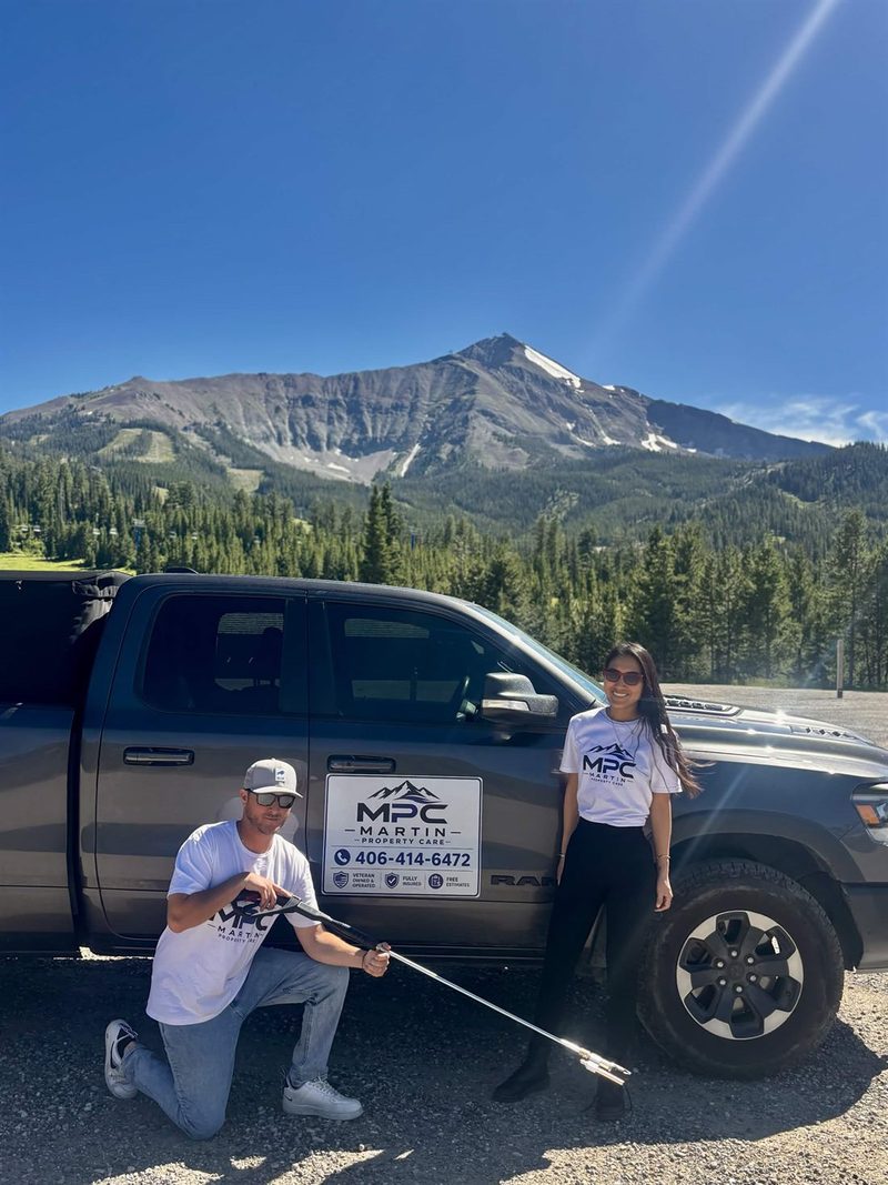 Tyler and Heidy with the Martin Property Care truck in the mountains